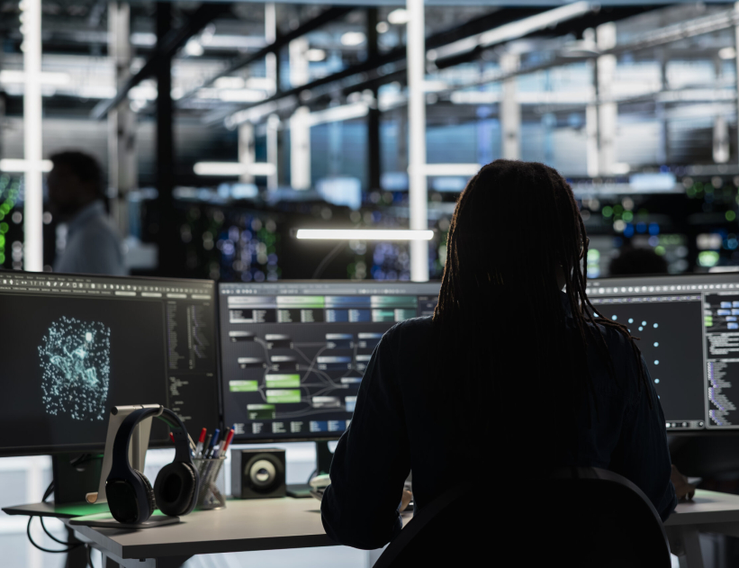 Server room engineer using artificial intelligence to enhance operational efficiency and reduce downtime. Admin AI driven solutions for data center infrastructure using node trees on PC